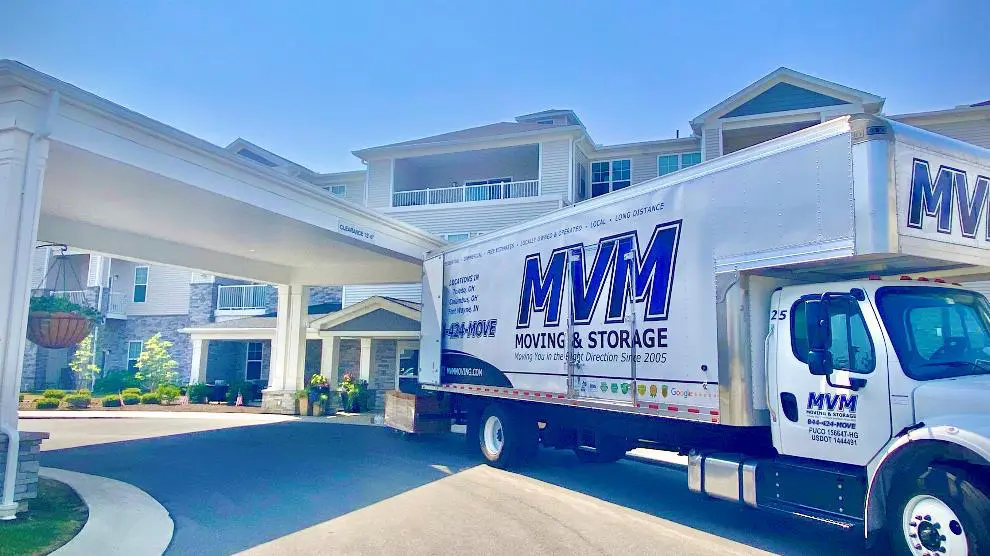 MVM Moving truck parked outside a senior center