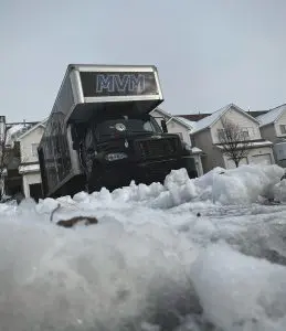 MVM moving truck in the snow representing moving during the winter