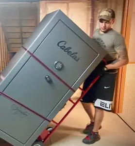 MVM Moving & Storage employee moving a Cabela's gun safe