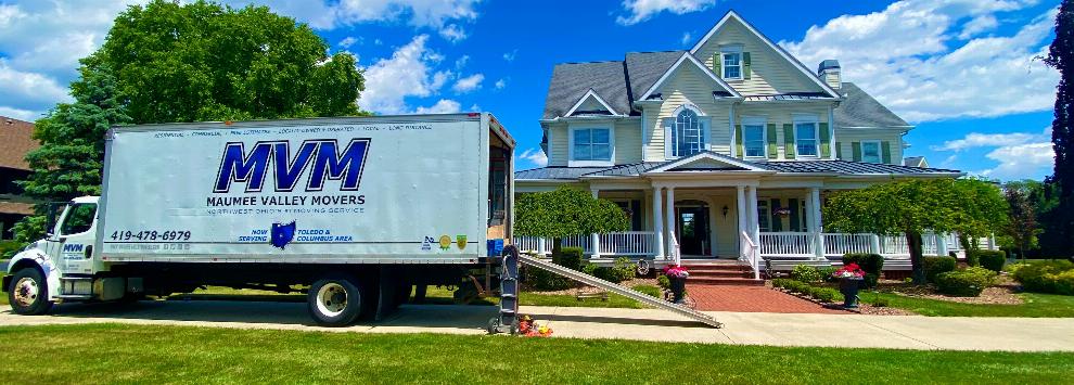 MVM Moving Truck parked outside a house for a local move