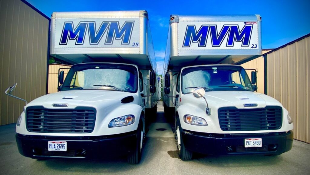 MVM Moving & Storage trucks parked side by side